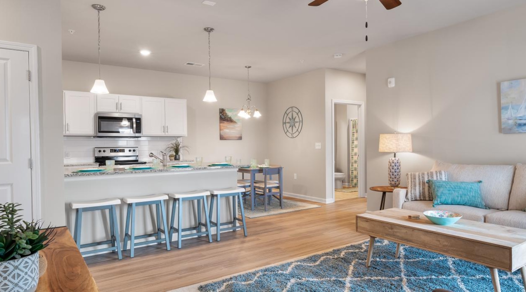 a living room with a bar and a table