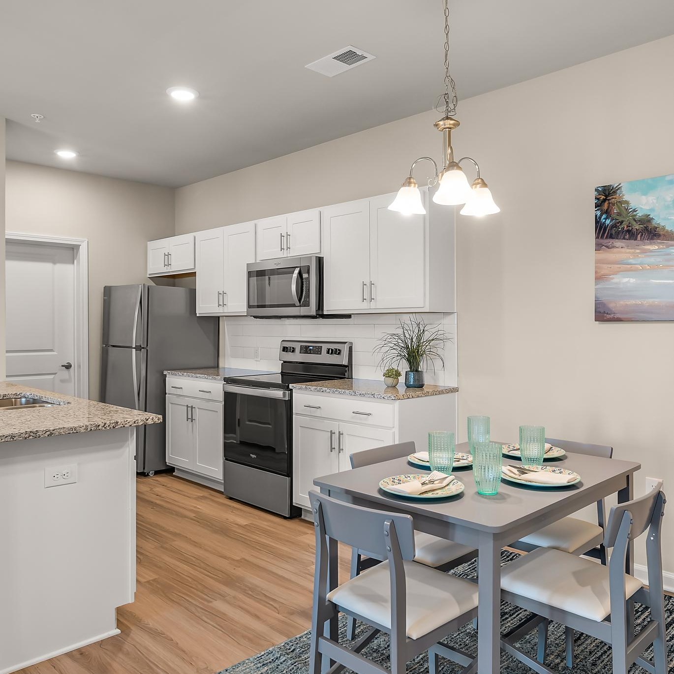 a kitchen with white cabinets