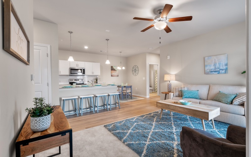 a living room with a bar and a table