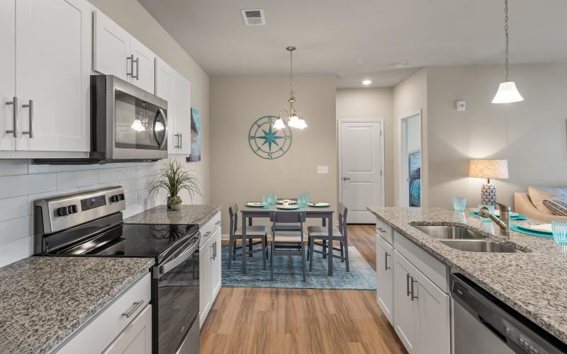 a kitchen with a table and chairs