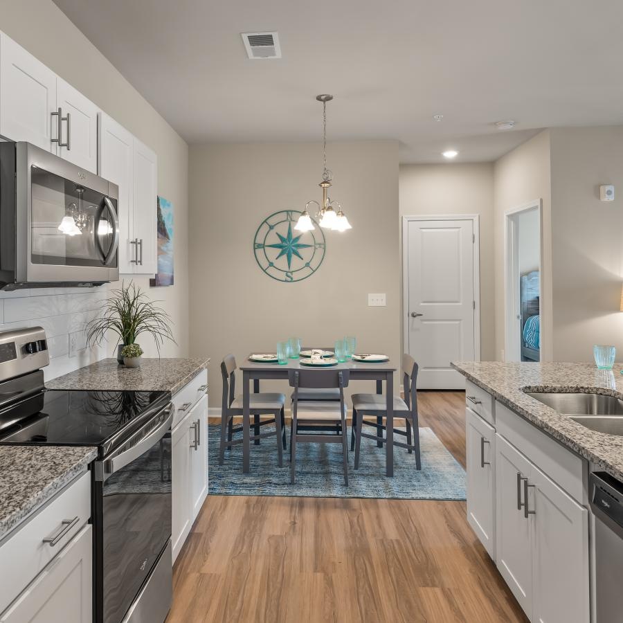 a kitchen with a table and chairs